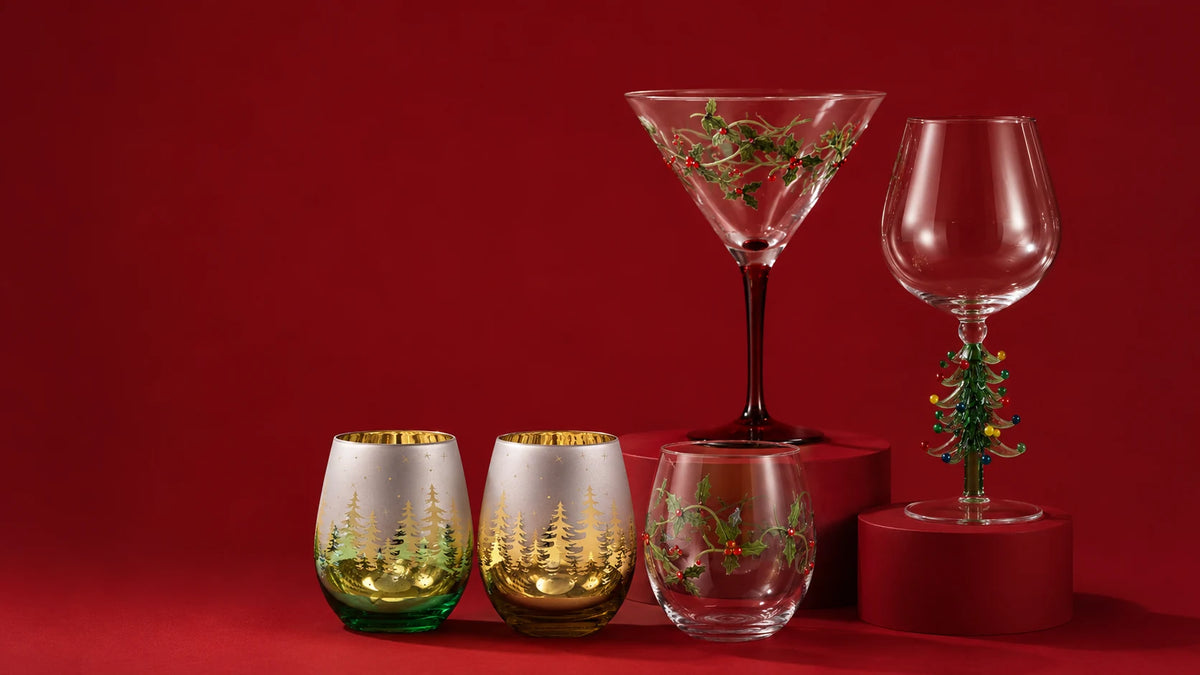 Mixed Christmas glassware against a red studio backdrop