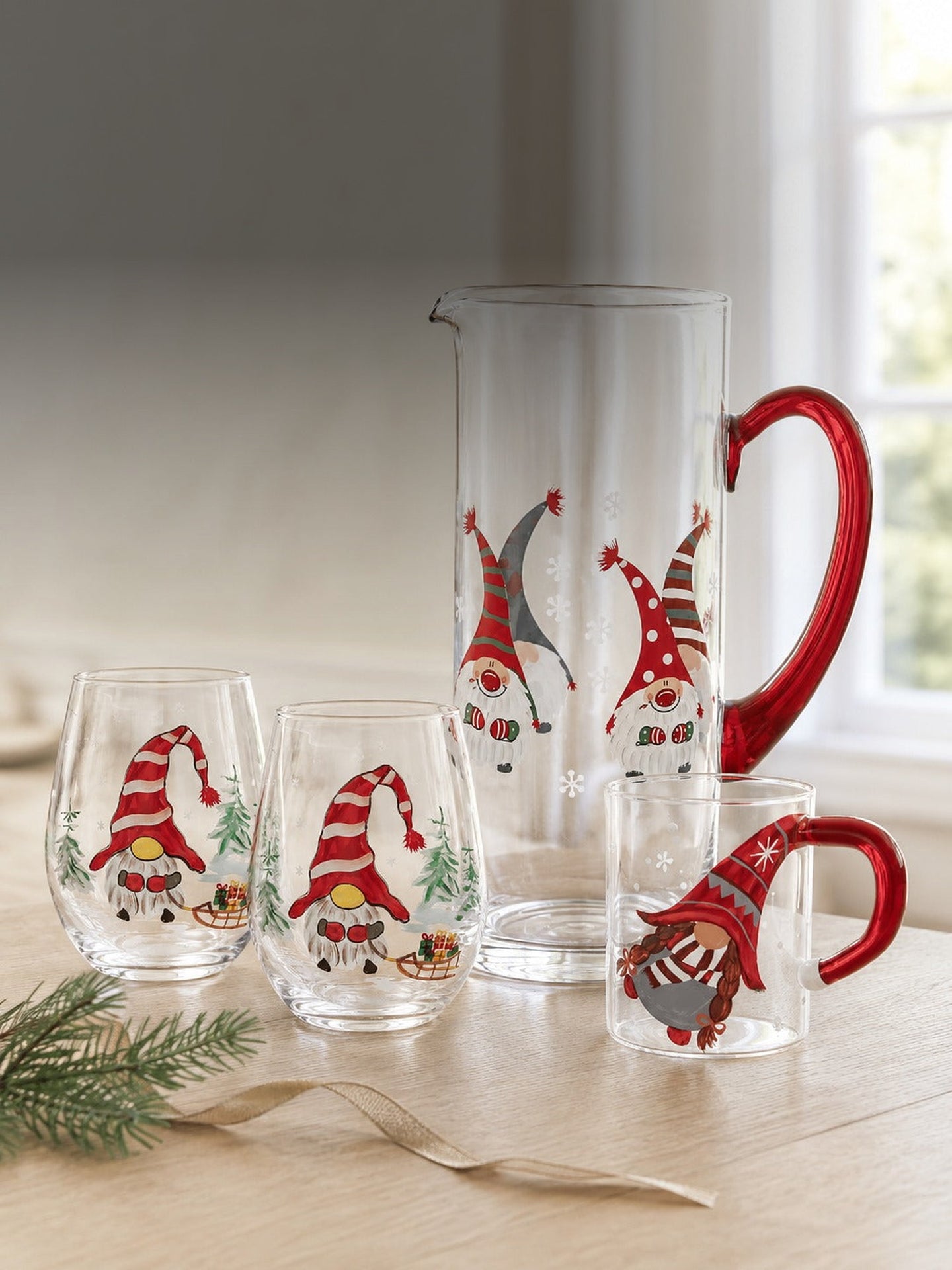 The hand-painted Christmas gnome collection - pitcher, stemless wine glasses and glass mug in daylight