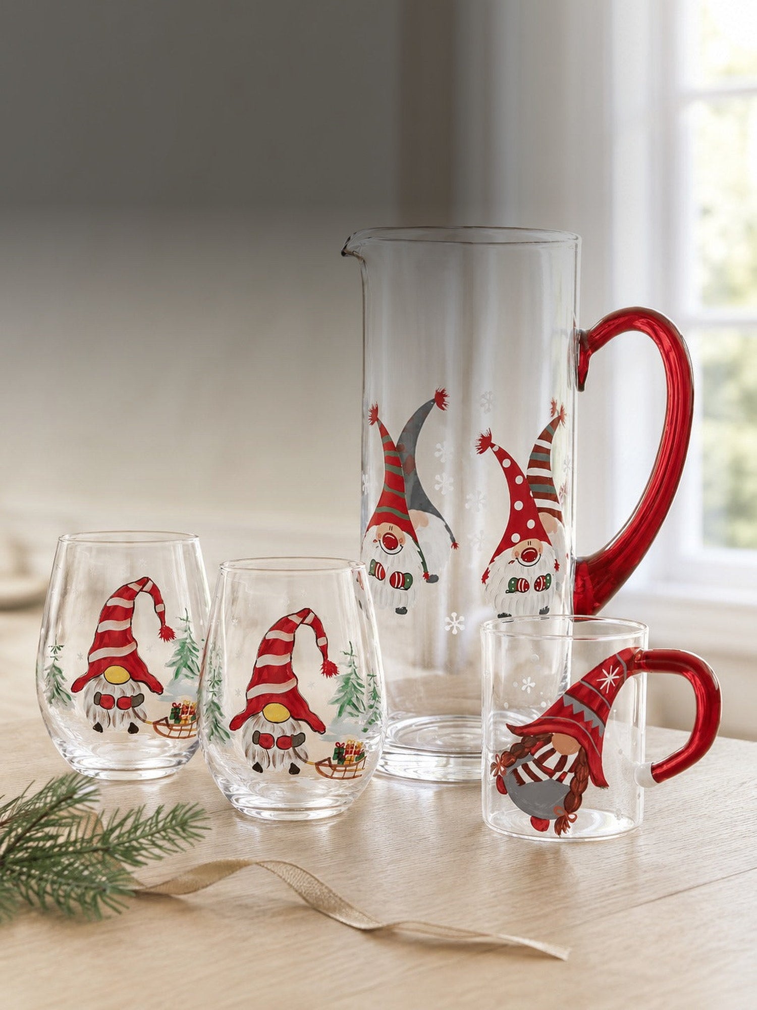 The hand-painted Christmas gnome collection - pitcher, stemless wine glasses and glass mug in daylight