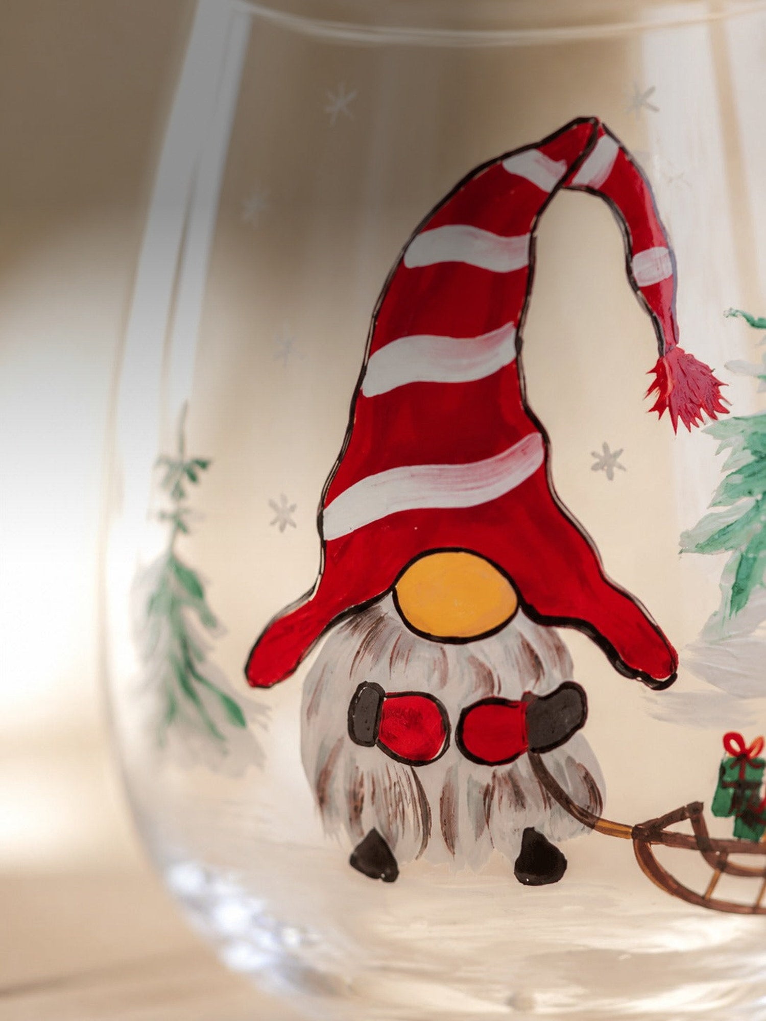 Macro detail of the hand-painted gnome brushwork on clear glass