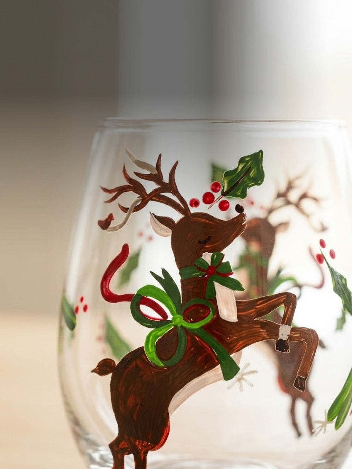 Macro detail of the hand-painted reindeer brushwork on clear glass